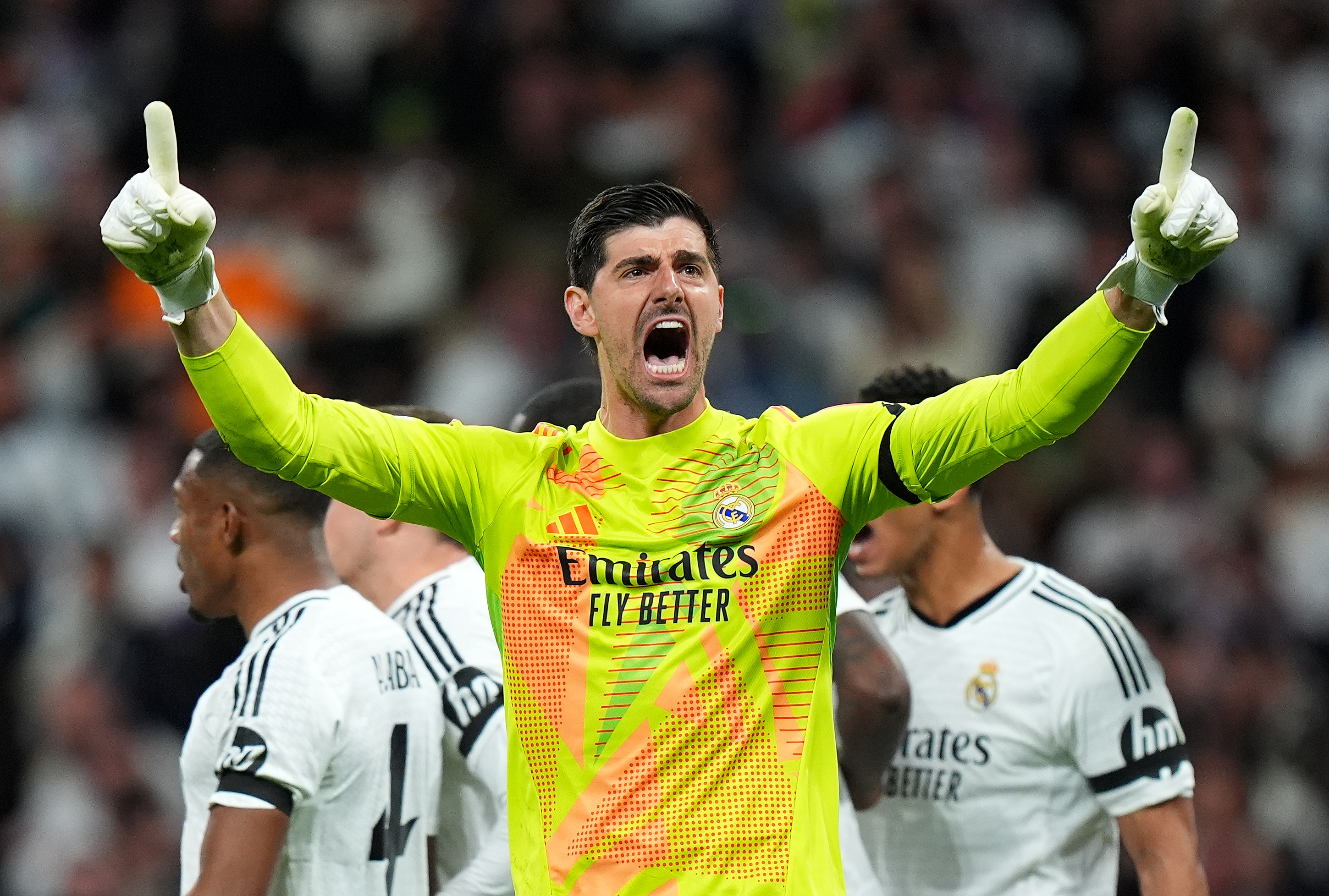 MADRID, SPAIN - APRIL 16: Thibaut Courtois of Real Madrid celebrates after saving a penalty kick from Bukayo Saka of Arsenal (not pictured) during the UEFA Champions League 2024/25 Quarter Final Second Leg match between Real Madrid C.F. and Arsenal FC at Estadio Santiago Bernabeu on April 16, 2025 in Madrid, Spain.