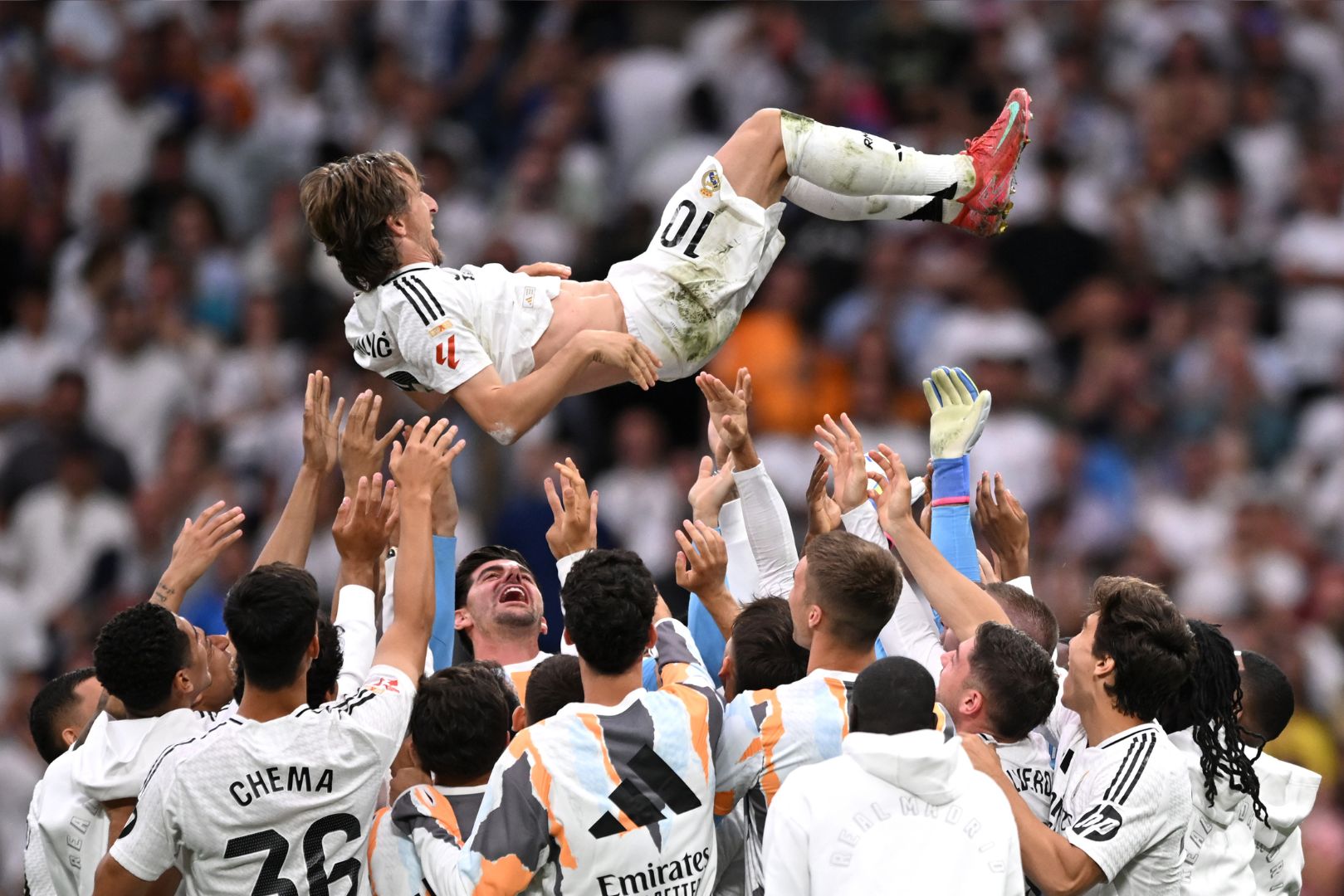 MADRID, SPAIN - MAY 24: Luka Modric of Real Madrid is lifted in the air by his teammates following his final appearance for Real Madrid after the LaLiga match between Real Madrid CF and Real Sociedad at Estadio Santiago Bernabeu on May 24, 2025 in Madrid, Spain.