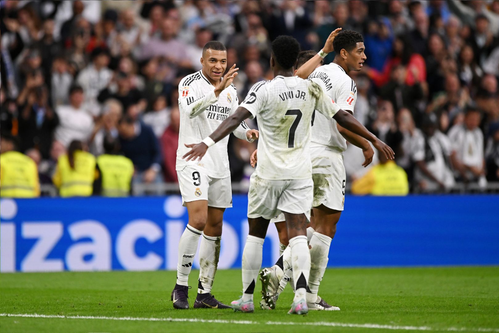 MADRID, SPAIN - MAY 04: Kylian Mbappe of Real Madrid celebrates scoring his team's second goal with teammate Vinicius Junior during the LaLiga match between Real Madrid CF and RC Celta de Vigo at Estadio Santiago Bernabeu on May 04, 2025 in Madrid, Spain.