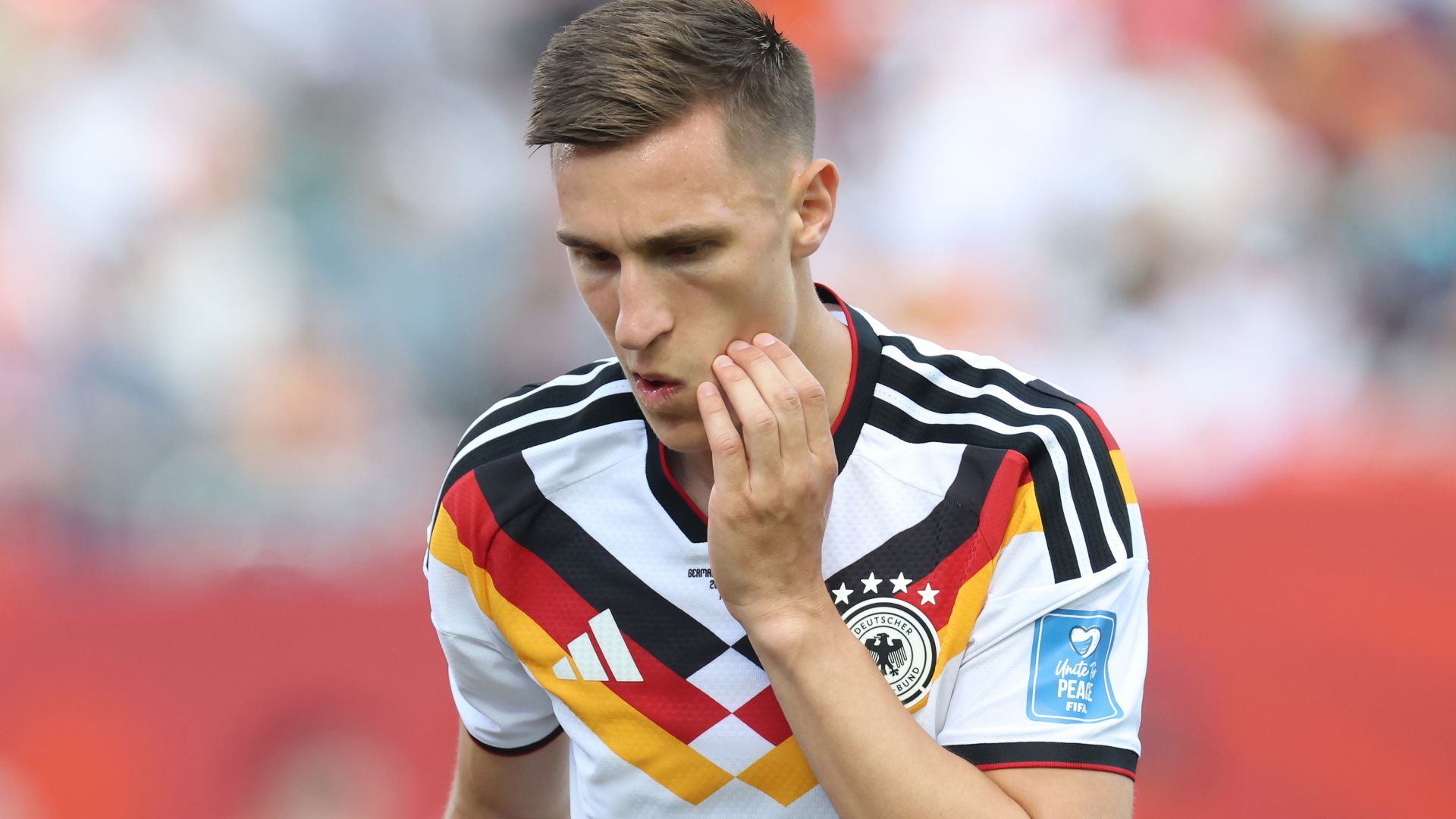 Nico Schlotterbeck #15 of Germany reacts after receiving medical attention during the FIFA World Cup 2026 Group E match between Germany and Cote D'Ivoire at Toronto Stadium on June 20, 2026 in Toronto, Ontario.