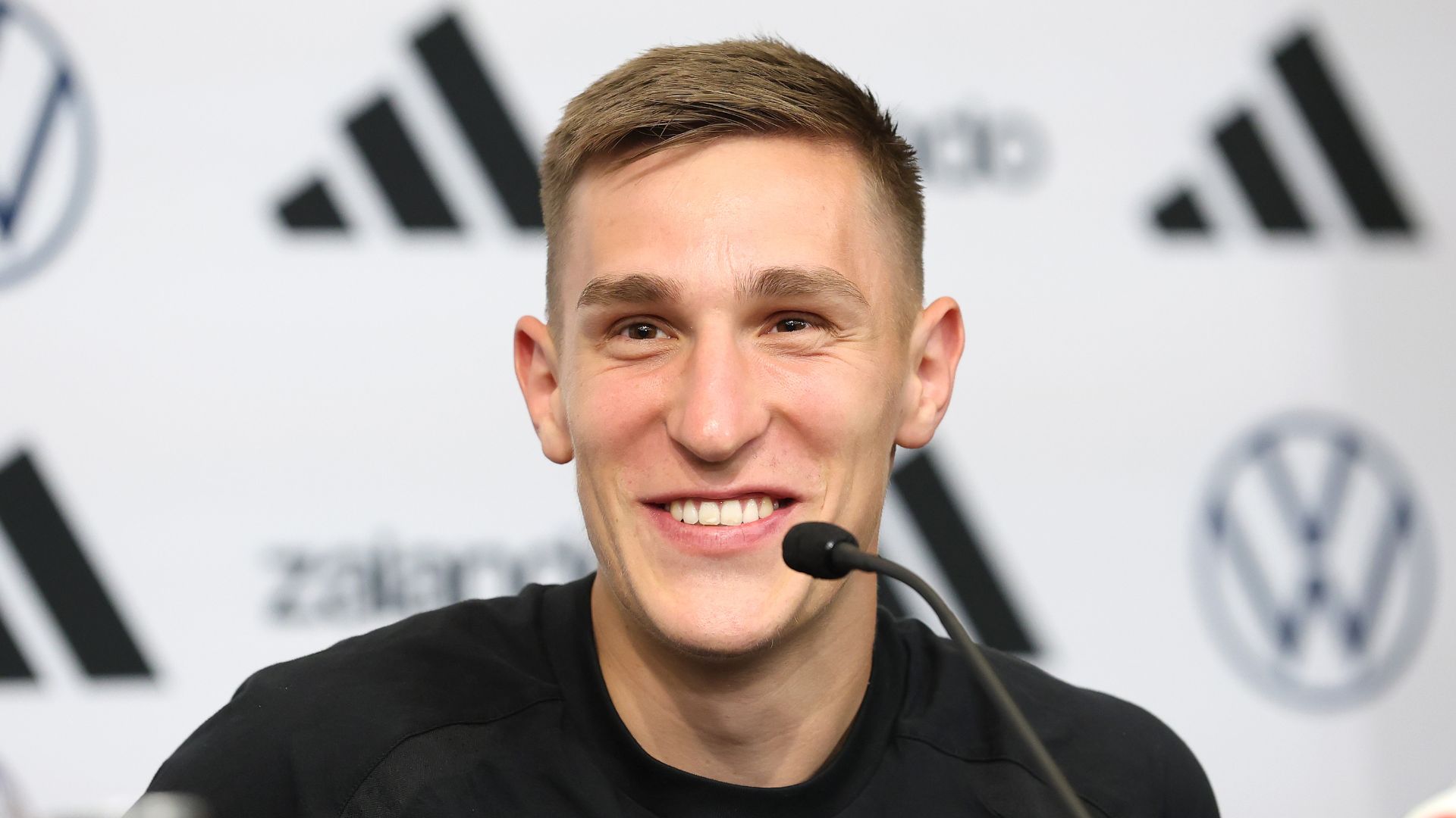 Nico Schlotterbeck of Team Germany talks to the media during a press conference at Donovan L. Nicol Hall of Excellence of Winston-Salem State University at Winston-Salem State University on June 11, 2026 in Winston-Salem, North Carolina.
