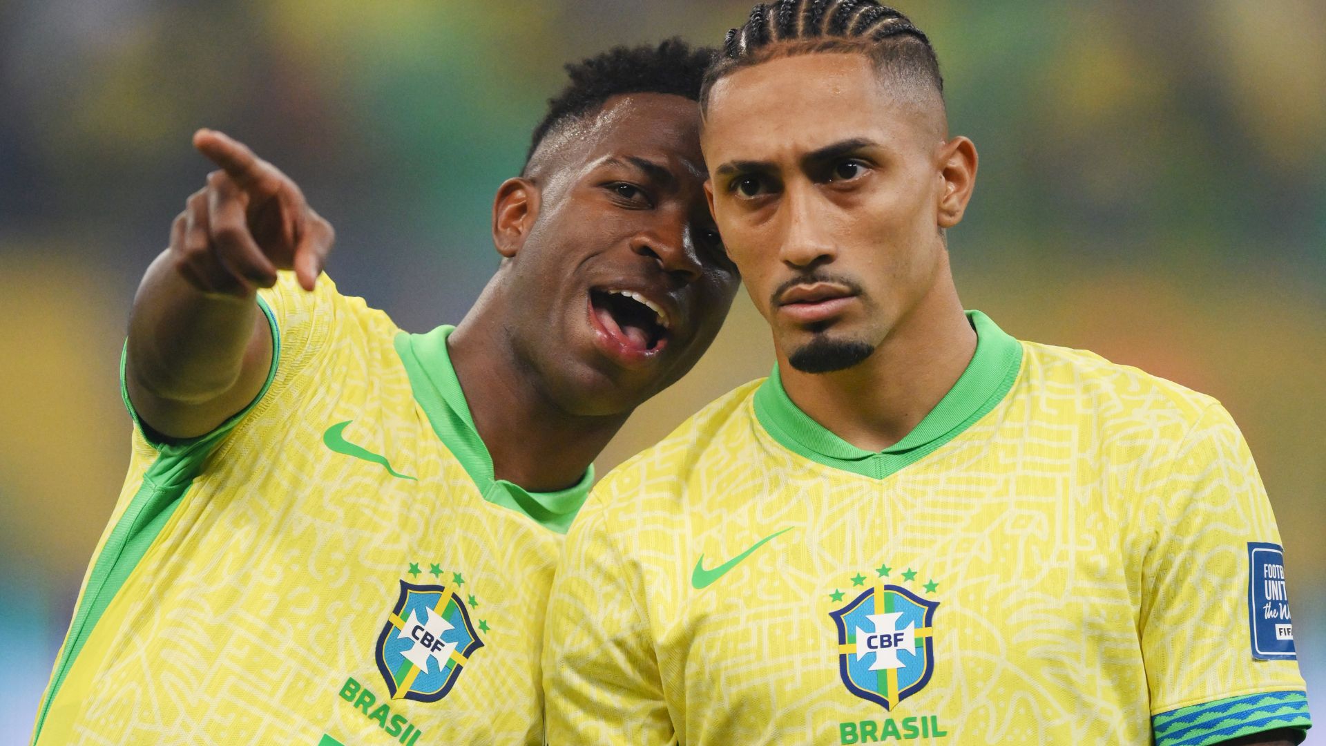 Vinicius Junior and Raphinha of Brazil talk as they line up prior to the South American FIFA World Cup 2026 Qualifier match between Brazil and Uruguay at Arena Fonte Nova on November 19, 2024 in Salvador, Brazil.