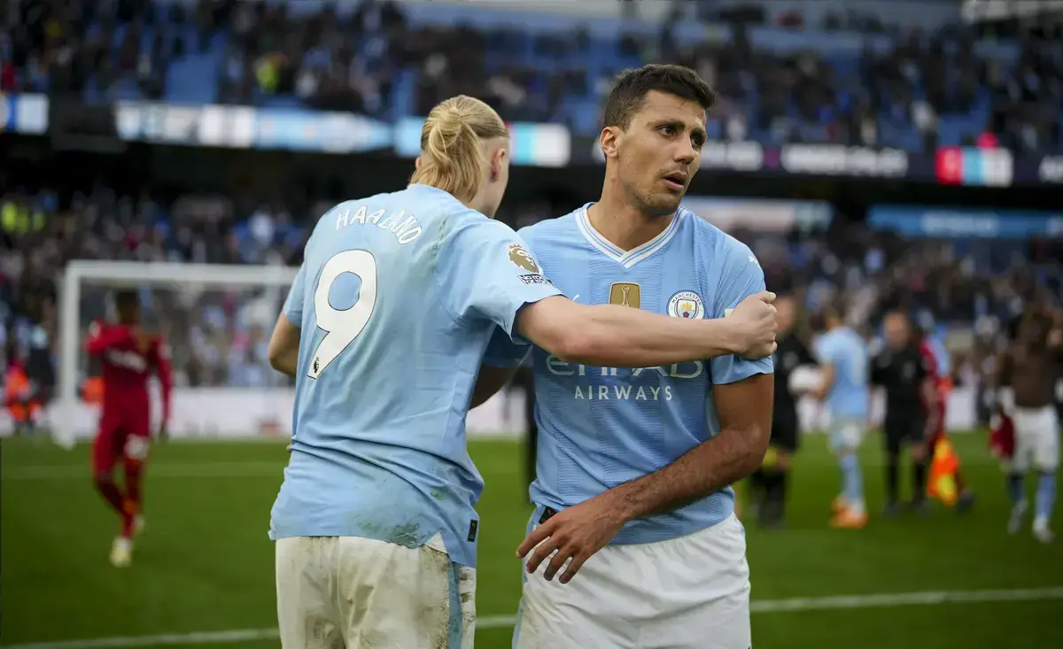 Rodri of Manchester City and Erling Haaland of Manchester City shake hands as they celebrate victory in the Premier League match between Manchester City and Wolverhampton Wanderers at the Etihad Stadium, Manchester, England. Saturday 4th May 2024.