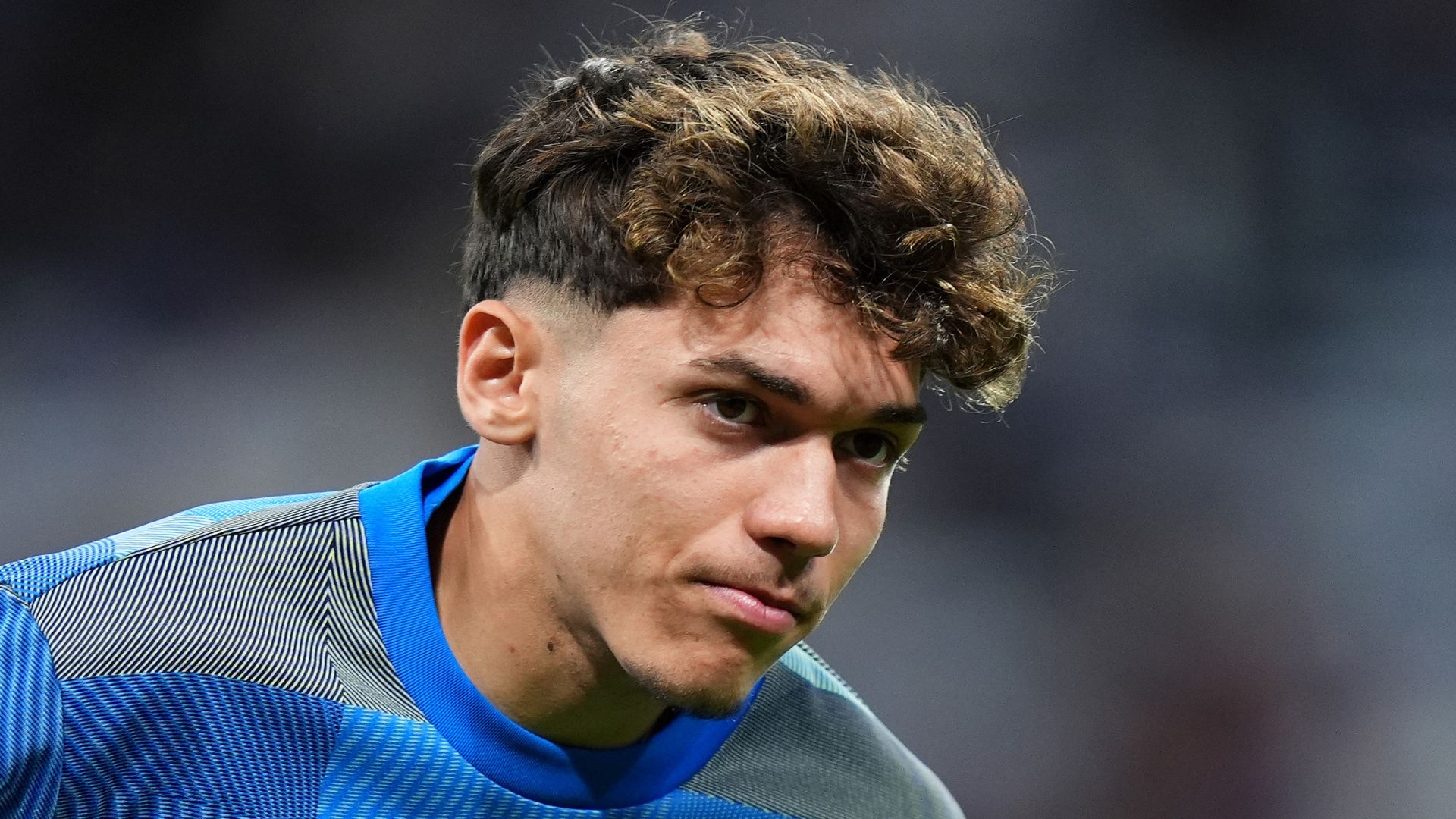 Thiago Pitarch of Real Madrid looks on during the warm up prior to the UEFA Champions League 2025/26 Quarter-Final First Leg match between Real Madrid CF and FC Bayern München at Estadio Santiago Bernabeu on April 07, 2026 in Madrid, Spain.